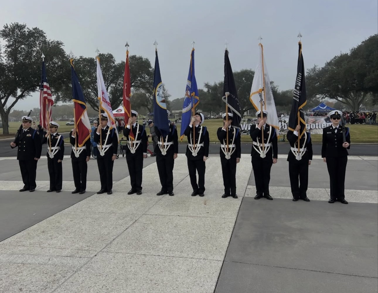 Kingwood NJROTC color guard presenting the national, state, and service flags in dress blues
