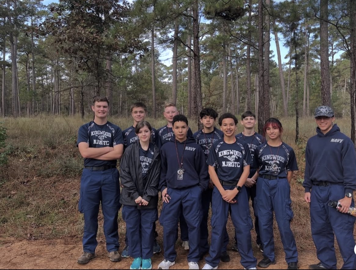 Kingwood NJROTC orienteering team gathered in the woods before a land navigation course